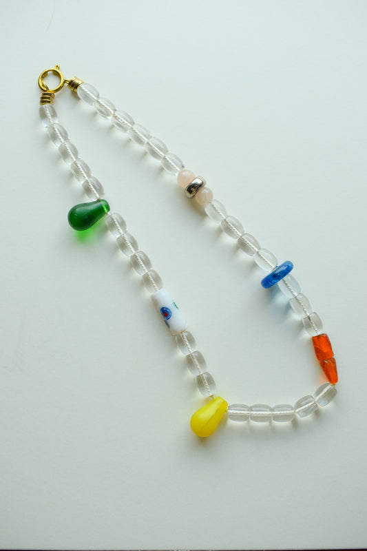 Beaded necklace with colorful beads on a white background